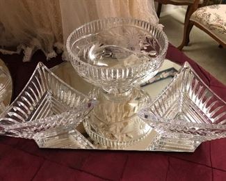 An exceptionally large collection of crystal bowls, trays, vases, footed bonbon, and serving pieces.