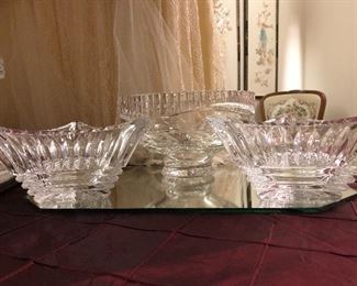 An exceptionally large collection of crystal bowls, trays, vases, footed bonbon, and serving pieces.