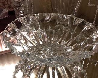 An exceptionally large collection of crystal bowls, trays, vases, footed bonbon, and serving pieces.