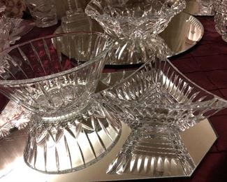 An exceptionally large collection of crystal bowls, trays, vases, footed bonbon, and serving pieces.