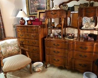 French provincial bedroom set. Fruitwood. Excellent vintage condition. Includes six drawer dresser, double mirror, five drawer chest of drawers, two matching side tables, and queen headboard.