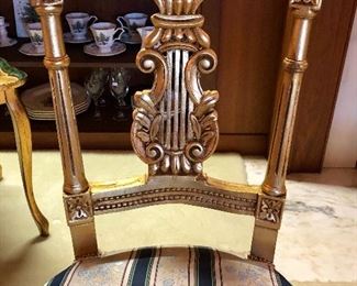 Louis the XVI style guilt chairs. Classic lines, visually interesting. The ultimate example of French refinement and sophistication.