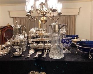 And array of silver plated items. Trays, bowls, serving pieces, water jugs, punch ladles, baskets, tiered serving pieces, goblets, casseroles, cake trays, more. 