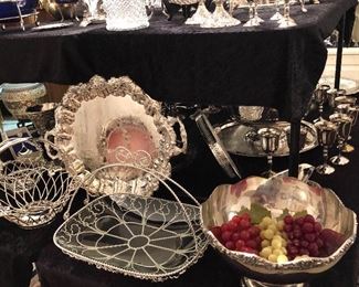 And array of silver plated items. Trays, bowls, serving pieces, water jugs, punch ladles, baskets, tiered serving pieces, goblets, casseroles, cake trays, more. 