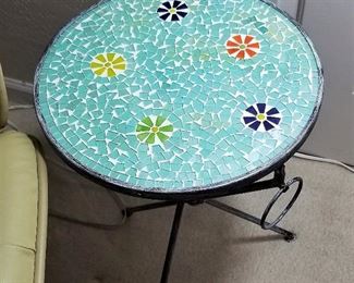 Mosaic table in turquoise and black. Can be used indoors or outdoors.