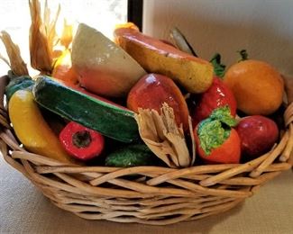 Ceramic fruit in a basket.