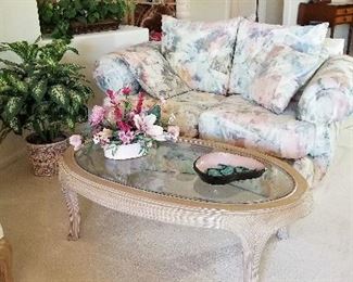 Great neutral oval coffee table with glass top and nice size loveseat.