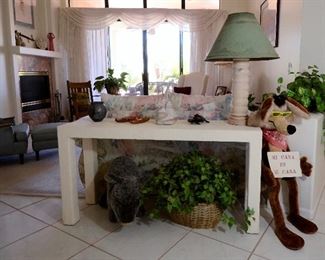 Neutral white console table in pristine condition.