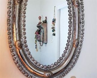 Metal silver oval mirror.