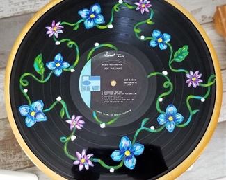 Handpainted art on vinyl records by local Arizona artist Isabela Rosalyn Olivares.