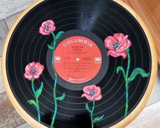 Handpainted art on vinyl records by local Arizona artist Isabela Rosalyn Olivares.