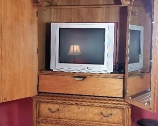 Matching Armoire can hold a TV or be used for storage.