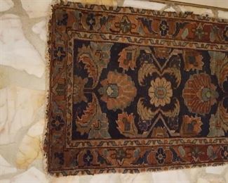 Small antique rug approximately 2' x 3'