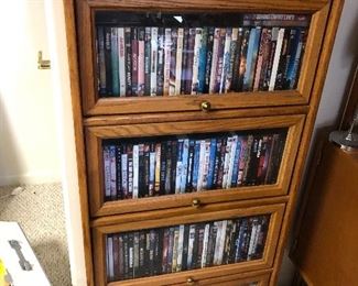 small barrister book case full of DVD's