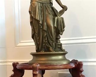 Staue on Asian wooden plant stand