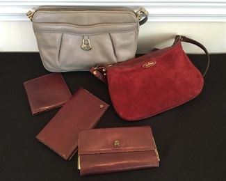 Various Etienne Aigner purses and wallets