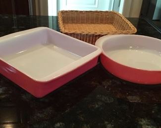 Vintage Pyrex casserole dishes and wicker holder