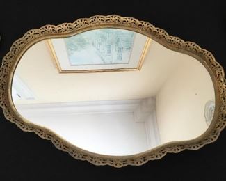 Display mirror with gold accents