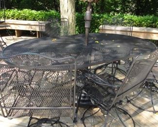 Wrought iron patio set with 6 swivel chairs
