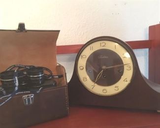 One of a pair of 7x35 field glasses in leather cases by Empire; German mantle clock by "Tradition" (works) with keys