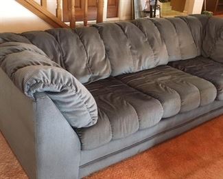 Three-person sofa in grey checked fabric
