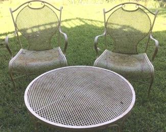 Pair of wrought iron & mesh arm chairs & coffee table in pale yellow paint