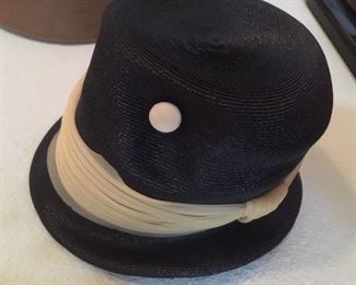Black and white felt hat with buttons and band