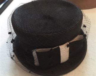 Black straw hat with wide ribbon and veil