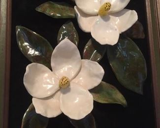 Detail of dimensional glazed ceramic magnolia wall art