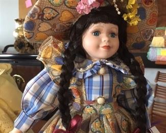 Porcelain and cloth body collector doll by Katrina Morandi, 2000 Series, dressed in plaid and hearts with label & certificate of authenticity