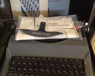 Electric typewriter by Sears with key guard, manual and hard shell case. Works great but needs new ribbon.
