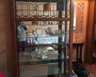 Curio cabinet-front slides left or right