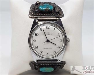 180: AMAZING!! Native American Timex watch, sterling with turquoise stones.
AWESOME!! Vintage Timex automatic watch in Native American sterling with beautiful turquoise stone and silver feathers and fine embellishment. Water resistant, stainless steel back, expandable underband at wrist. This piece is stunning!
J14 3/3