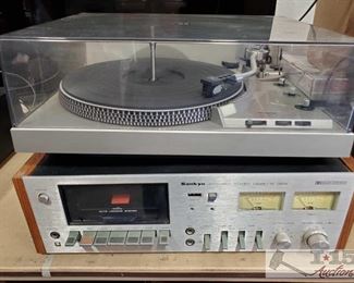 406:
Tecnics Turnatable System and Sankyo Cassette Deck
Viiiiiinnntage!!! Technics by Panasonic direct drive automatic turntable system, model #SL-1950 features B-FG servo control accommodates 6 records at a time. Also pictured here, a Sankyo STD 1900 stereo cassette deck STD-1900 made in 1978.