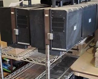 420:
12 Eiki Projectors on a Rolling Rack
In this lot are Eiki Super Slot-Load II 16mm movie projectors, various film tins, splicing tools, and projector parts. Metal wire rack on wheels measures approx 48" x 18" x 41"