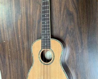 429:
Greg Bennett UK-70 concert ukulele
Cool find! A genuine concert-sized Greg Bennett UK-70 acoustic ukulele in sycamore grain with abalone inlay binding and rosette.