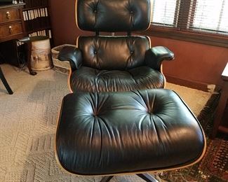 Eames lounge (670) and ottoman (671). Black leather