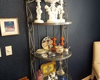 Iron & glass credenza displaying china and other items. Top set is Spode