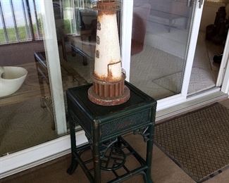 Wicker stand with lighthouse decor