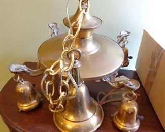 Antique 4-arm brass pan light fixture with blue etched ruffled shades. 