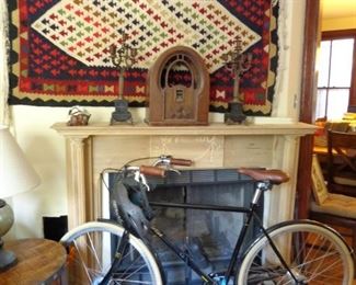 Antique Kilim wool woven rug, along with the Philco radio and detached wooden mantle. 