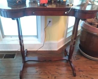 Kidney shaped table with carved ends