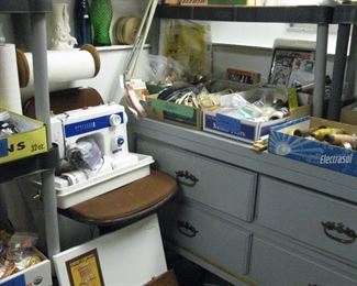 White sewing machine  sewing supplies and art supplies