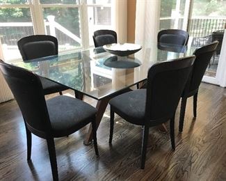 Modern kitchen table and 6 leather chairs with dark wood frame.  