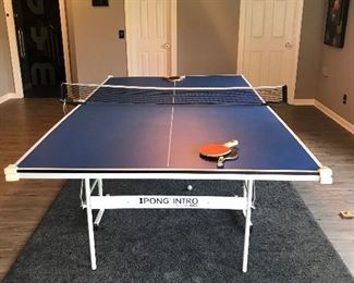 Easy to store Ping Pong table, two sides fold up and roll away.