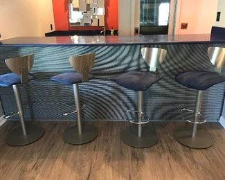 4 modern swivel barstools, stainless steel backing, micro suede fabric, height adjustable. 