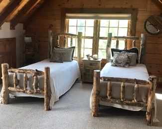 Rustic natural log twin beds