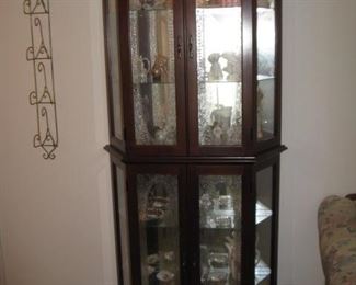 another lighted curio cabinet