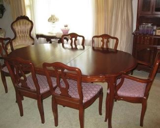 Cherry dining table with 3 leaves, pads, 8 chairs