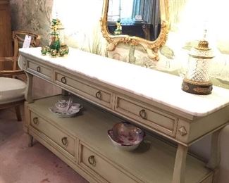 Marble top sideboard and crystal lamps.